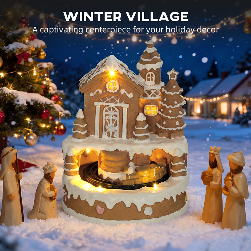 Lit winter village display beside a nativity scene