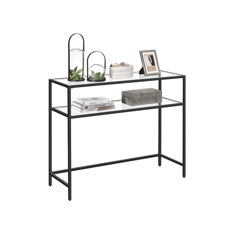 Black console table styled with lanterns above books on the lower tier