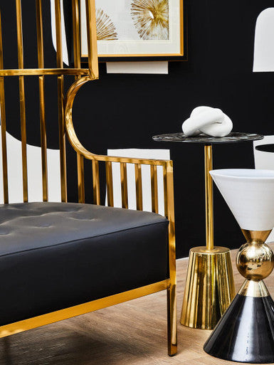 Side view of the gold dome cage 2 seater sofa in a styled room
