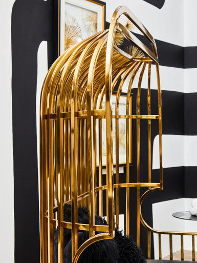 Gold dome cage sofa shown as a statement piece in a lounge setting