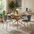 Gold fir wood round dining table styled in a dining room with grey chairs