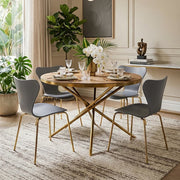 Gold fir wood round dining table styled in a dining room with grey chairs