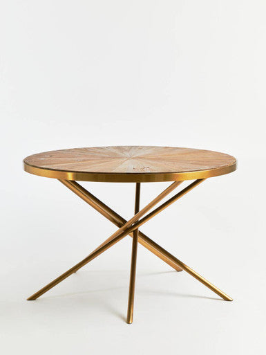 Assembly step showing the gold stainless steel base components for the dining table