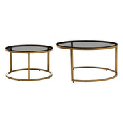 Gold and glass round nesting coffee tables studio shot, nested together
