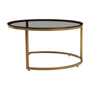 Gold and glass round nesting coffee tables studio shot, separated