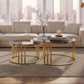 Gold metal and tinted glass round nesting coffee tables styled in a living room