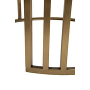 Close-up of gold frame and glass tabletop edge