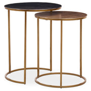 Nest of two gold metal side tables shown nested together on a plain background