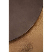 Close-up of the luminous zinc-toned metal tabletop surface