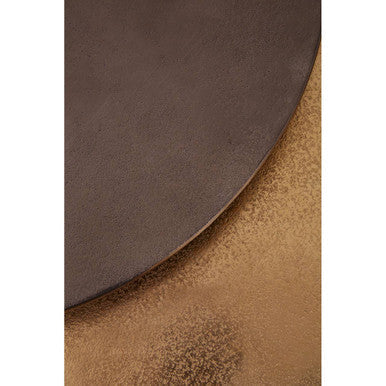 Close-up of the luminous zinc-toned metal tabletop surface