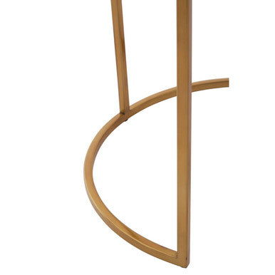 Close-up of the gold finish on the slim metal table frame