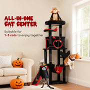 Three cats in costumes playing and resting across the multi-level Gothic cat tree