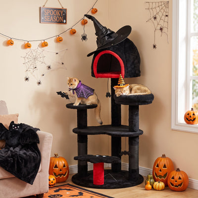 Two cats in Halloween costumes on the Gothic cat tree beside a Spooky Season sign