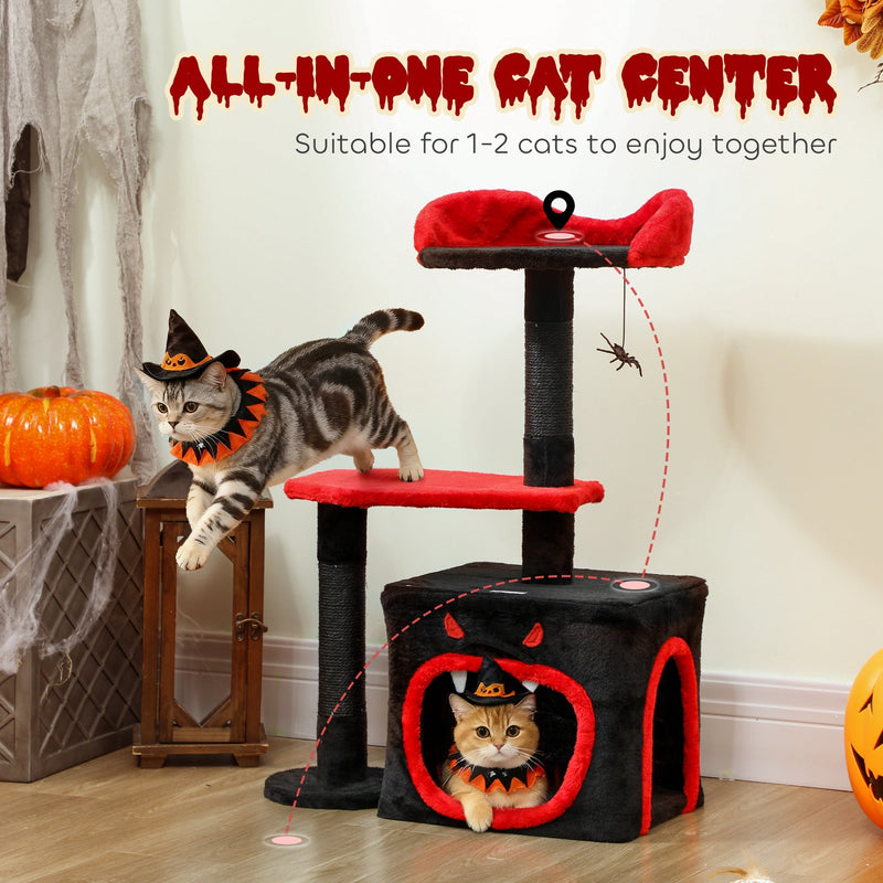 Cat leaping toward the cat tree while another cat rests inside the coffin-style cat house