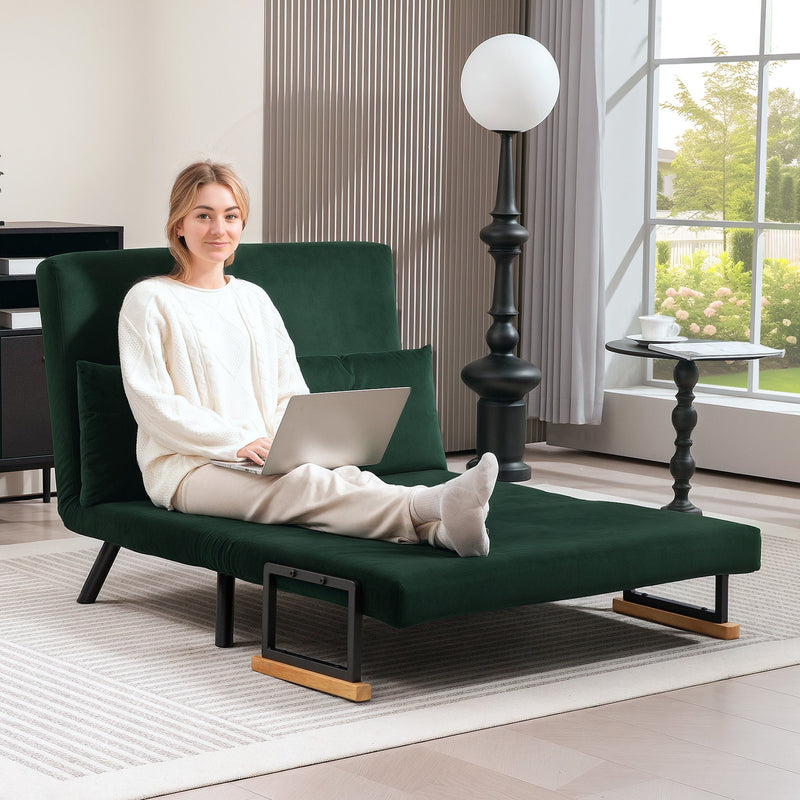 Woman using a laptop in the floor-sofa lounge configuration