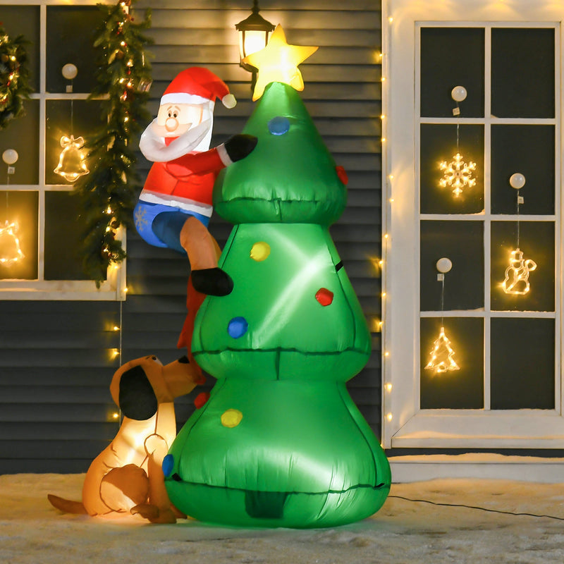 Lit inflatable Christmas tree, Santa and dog in front of a house with window decorations