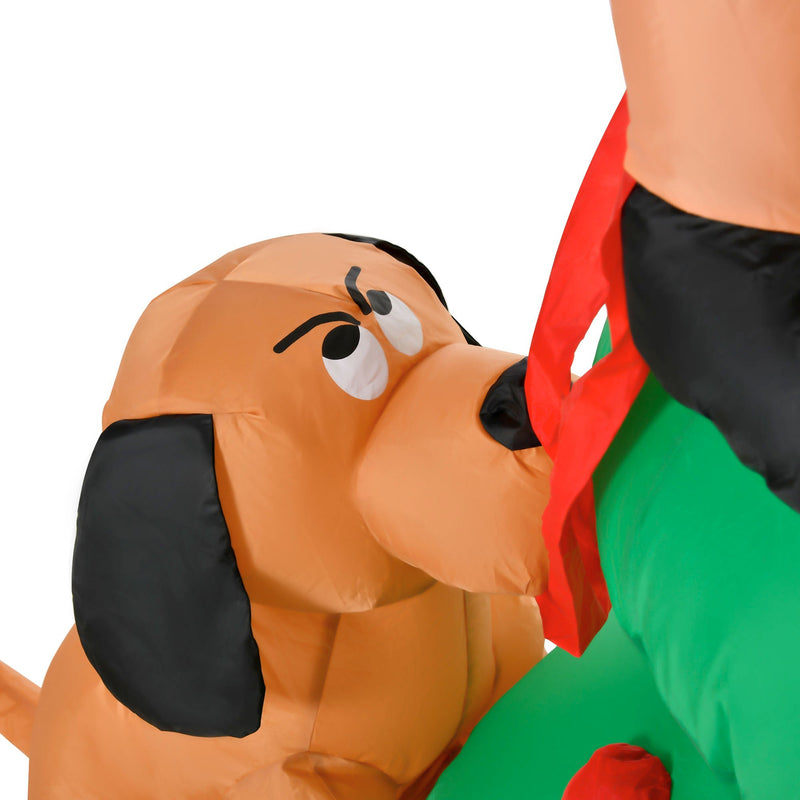Close-up of the brown inflatable dog looking up at Santa