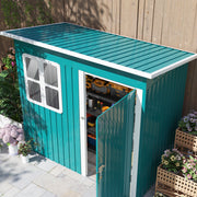 Raised view of the green shed showing the sloping pent roof and the open door with tools stored inside