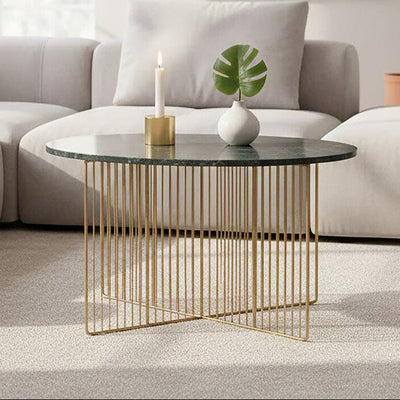 Green marble round coffee table with gold iron frame in a living room setting