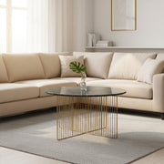 Green marble coffee table styled beside a sofa in a compact lounge