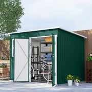 Green metal garden shed on a patio with doors open, showing a bike and shelving stored inside