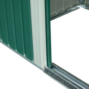 Close-up of the shed's open doorway showing the galvanised steel base rail and sliding door track