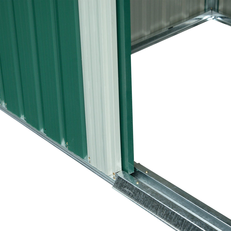 Close-up of the shed's open doorway showing the galvanised steel base rail and sliding door track