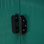Green shed door handle photographed from the front, with the padlock slot centred between both doors