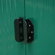Close-up of the black handle and padlock hasp fitted where the green shed's two doors meet
