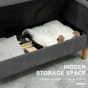 Storage compartment open under the seat, showing a blanket and books tucked inside