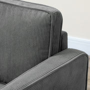 Close-up side view of the armrest and corduroy fabric texture