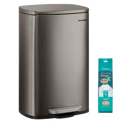 Grey steel 50 L pedal kitchen bin with a pack of bin bags beside it