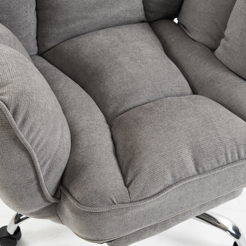 Close-up of the puffy padded seat and armrest in grey fabric