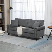 Grey fabric sofa styled in a living room with lamp and throw blanket
