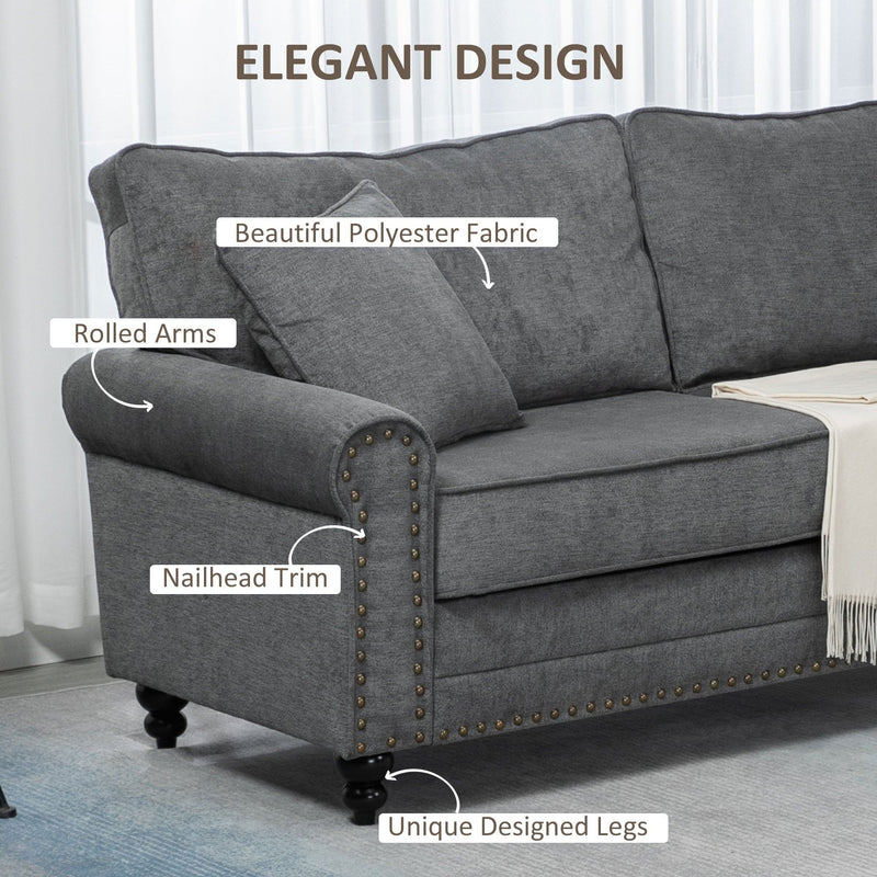 Rolled arm and nailhead trim detail on grey polyester fabric sofa