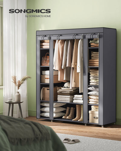 Grey fabric wardrobe styled in a bedroom beside a bed and a window