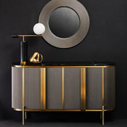 Grey fluted sideboard with black marble top styled in a living room