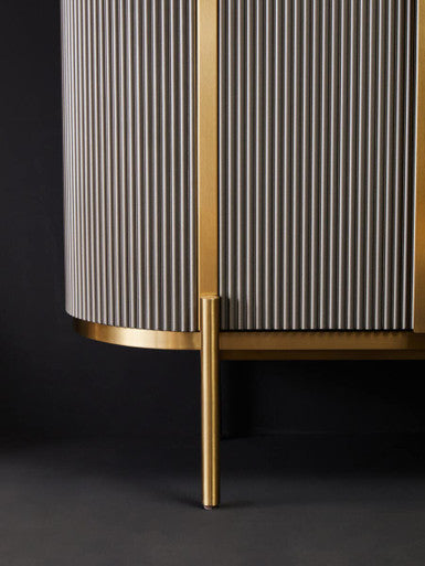 Grey fluted sideboard styled in a lounge setting