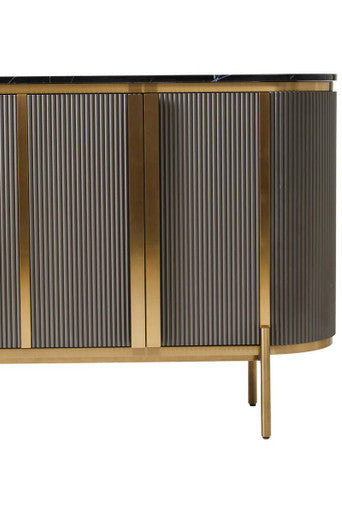 Macro detail of the fluted door panelling and gold trim