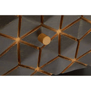 Close-up of the gold-finish iron frame and its joint to the wooden top