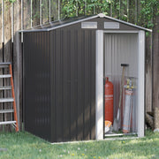 Grey metal garden shed against a wooden fence with the sliding door open, showing tools and a gas bottle stored inside