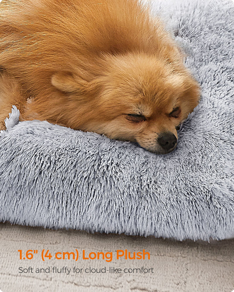 Close-up of the long plush grey fluffy texture with a dog resting on the bed