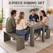 Four people eating at the table with two benches in a bright dining area