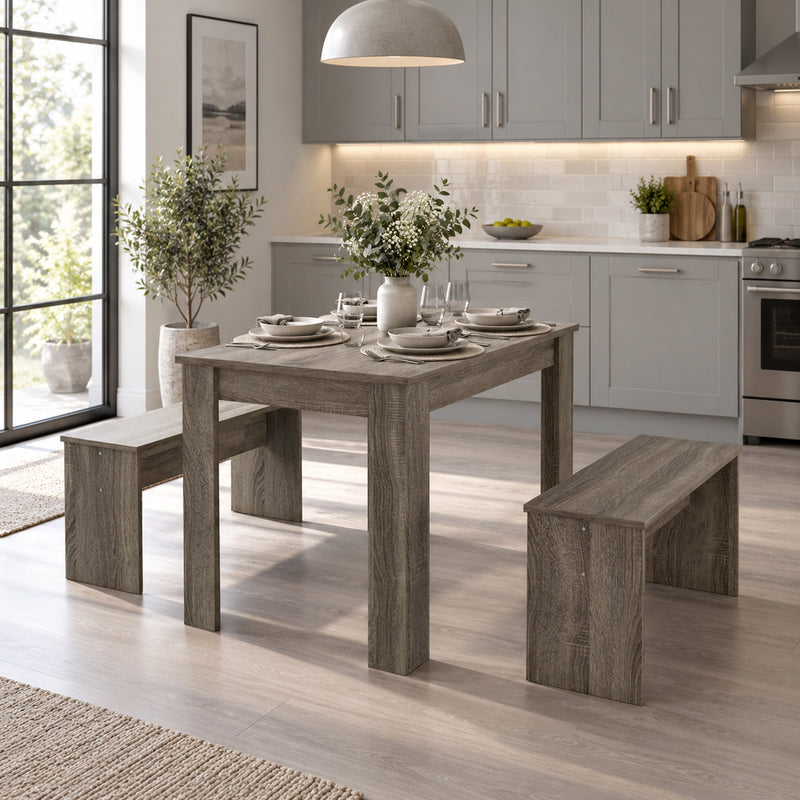 Dining set in a kitchen with grey cabinets and a large window