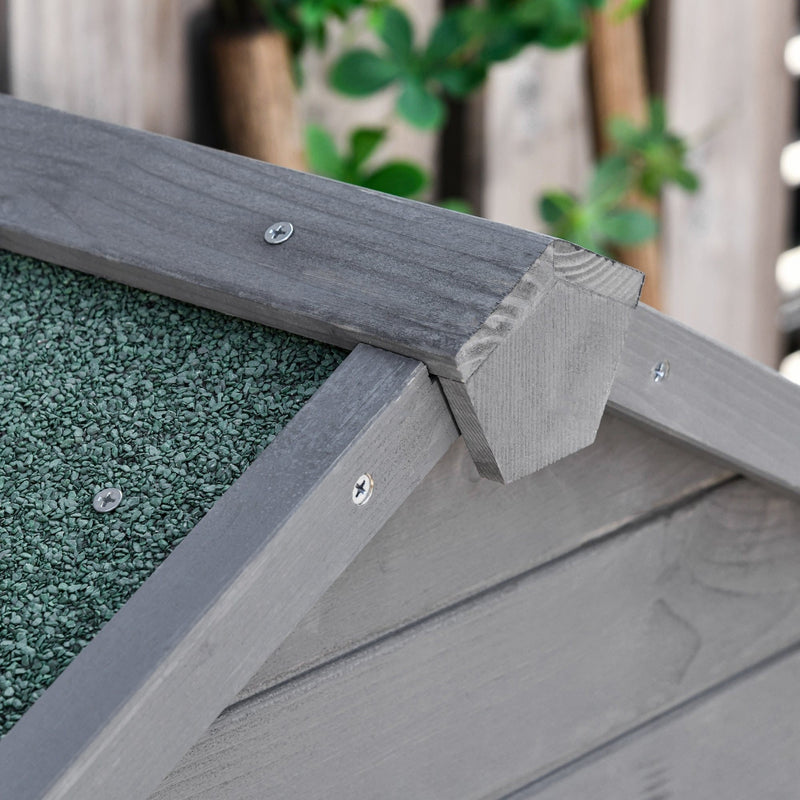 Close-up of the apex roof ridge showing green mineral felt and a screwed timber cap