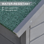 Close-up of the green asphalt felt roof edge and water-resistant painted timber