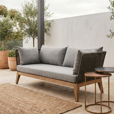 Grey woven rope 3 seater sofa shown in an outdoor patio setting