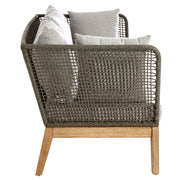 Side view of the grey woven rope sofa on a plain background