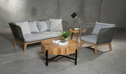 Grey woven rope sofa styled in a furnished living room