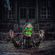 Homcom groundbreaker skeleton animatronic lit up at night outside a spooky house lifestyle scene